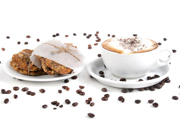 Cup of coffee and biscuit isolated on the white background, close-up, shallow depth of field.