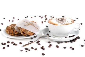 Cup of coffee and biscuit isolated on the white background, close-up, shallow depth of field.