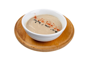 bowl of broccoli and green peas cream soup isolated on white background