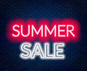 Summer sale neon lettering on brick wall background.