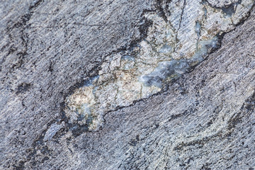 The background or texture of the marble wall of the quarry or opencast. The surface of the marble stone or rock