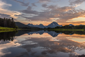 Reflection of Grand Tetons at sunset