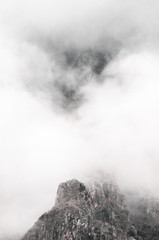 High mountains and rocks in the clouds
