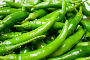 Green chili peppers background.