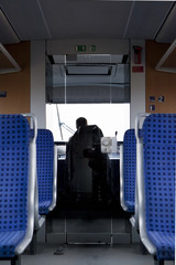 Naklejka na ściany i meble German train with blue seats symmetric comfortable travels train driver