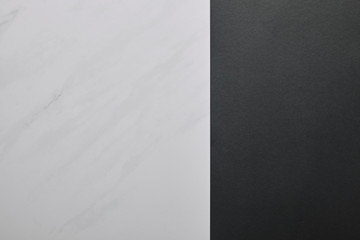 Blank black paper on white marble background