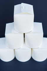 White wok containers on the dark background