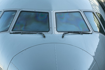Fototapeta premium Close up of a jet airplane cockpit Front view of the airplane window with windshield wipers.