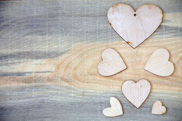 pattern of wooden hearts on a wooden background