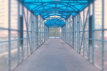 Elevated pedestrian crossing from the inside. Safe passage across the road.