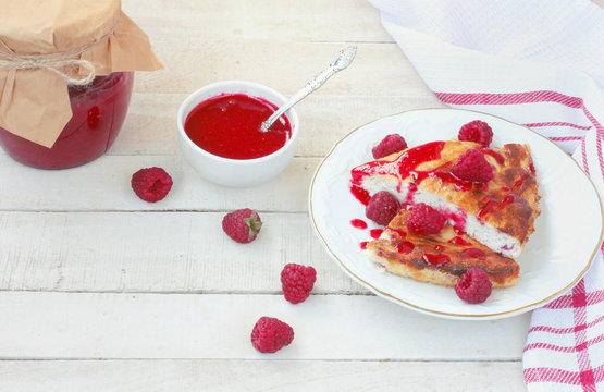 pieces of curd pudding with raspberry jam