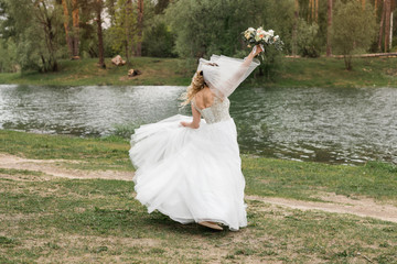 Fototapeta na wymiar Wedding on the river bank. Happy bride