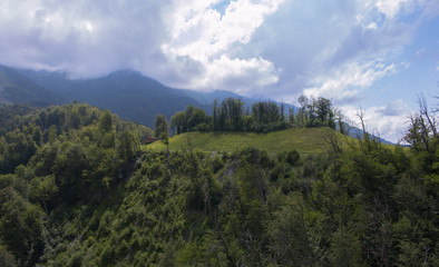 Fototapeta premium Aerial view - landscape of tree, mountain from the top of mountain a sunny cloudy day