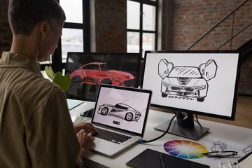 Businessman using laptop at desk