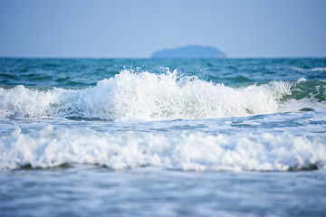 Soft wave of blue ocean on sandy beach background,ocean waves,storm,beautiful background,close-up
