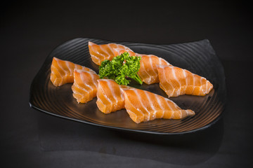 Salmon Sashimi, Fresh Salmon, Japanese food style, Japanese menu food menu on black background, Traditionnal Japanese food, selective focus