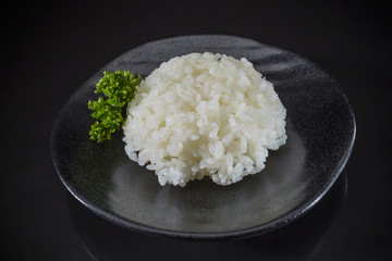 Japanese cuisine, steamed rice with on black background, Japanese food, Japanese dish