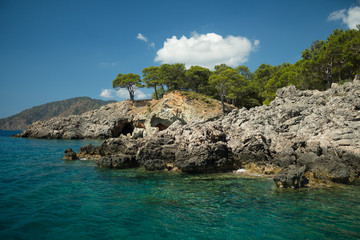 Obraz premium Vivid blue sea in laguna and rock Turkey