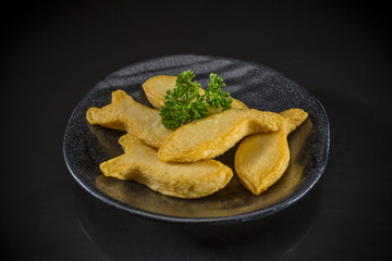 Fried Fish Tofu, Shabu Asian food, fish ball on black background, Japanese food and Traditional Chinese food