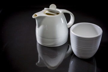 CeramicTeapot, Organic Green Matcha Tea, Cup with green tea on black background, drink for health, Hot green tea, copy space, Ceramic