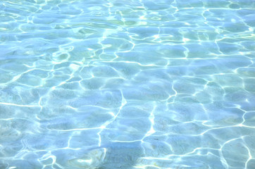 Naklejka na ściany i meble surface of blue swimming pool, background of water in sea