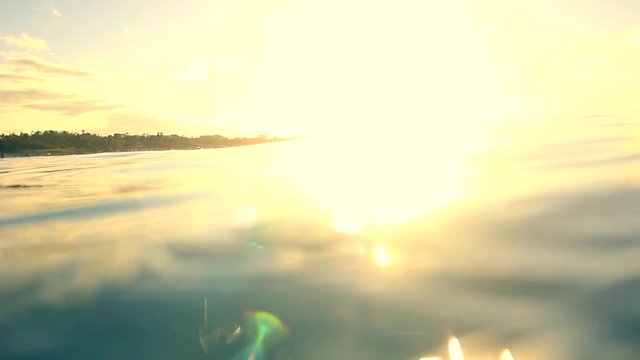 Sunset on the Caribbean Sea and underwater view. Filmed in the Cuba coast.