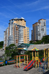 Fototapeta na wymiar Vladivostok, Russia. Playground on the background of the residential complex