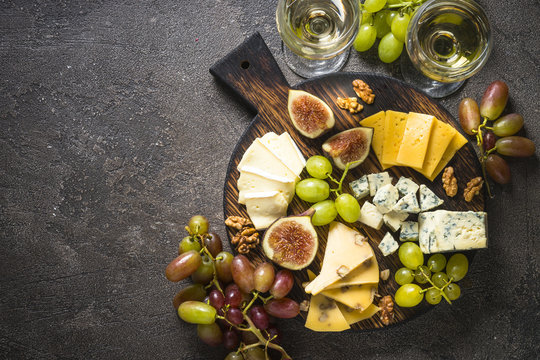 Cheese Plate With Grapes, Figs And Nuts.