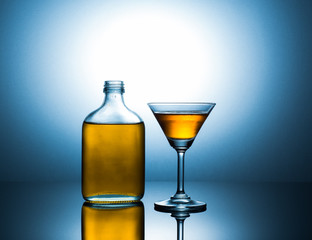 martini and flat bottle with alcohol .