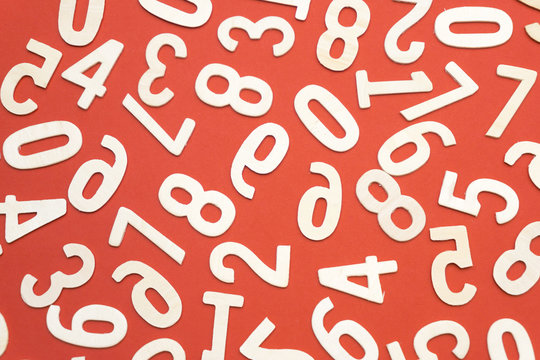wooden numbers on red paper
