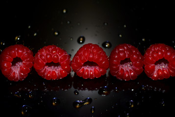 Beautiful raspberry berry with water drops