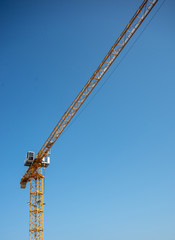 Naklejka premium Construction Crane and Clear Blue Sky