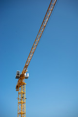 Naklejka premium Construction Crane and Clear Blue Sky