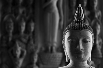 buddha statue face in the temple - monochrome