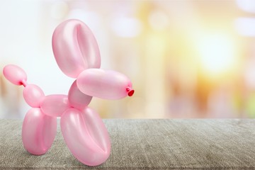 Pink balloon in form of dog