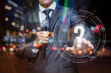 Speaker clicks on the screen with a question mark.