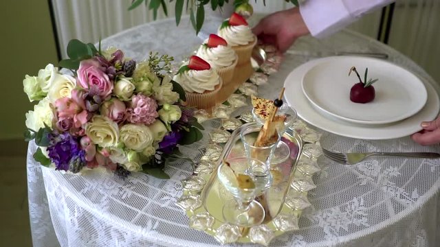 Waiter serves a wedding table.