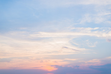 Stunning clouds and orange sunset in the bright sky