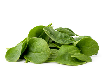 Pile of spinach leaves isolated on a white.