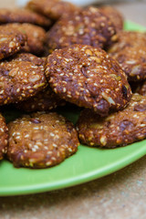 Closeup of a Plate of Molasses Oatmeal Cookies with Nuts and Seeds