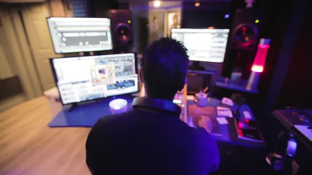 Audio engineer in a recording studio.