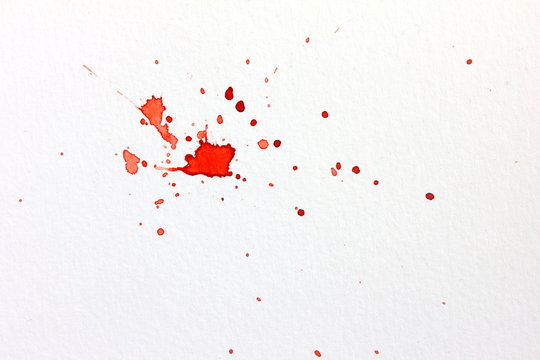 Watercolor paper textured background with red paint blood splatter