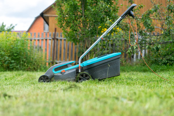 outdoor worker mowing the lawn