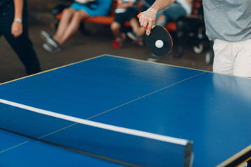 Table for ping pong and player with racket