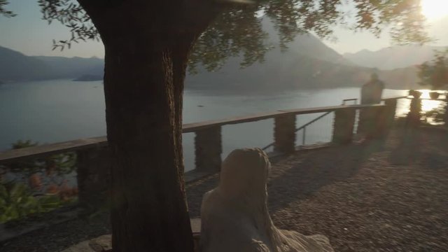 vezio castle, view over the lake and the alps mountains , inside of the old stone castle there are lot of sculpture of gosth