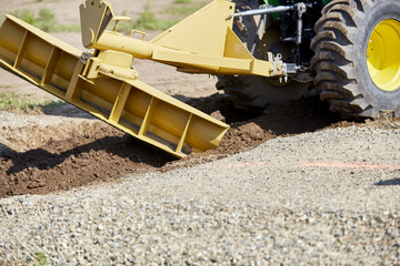 Grader making a drainage ditch
