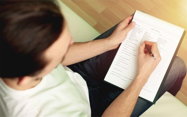 Hand writing in clipboard.