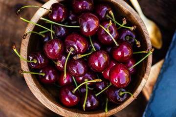 Fresh Cherries in the wooden bowl