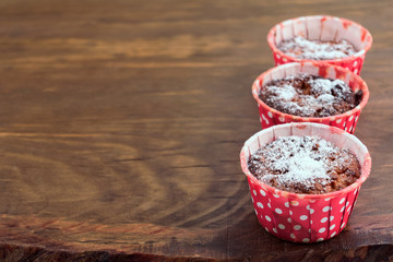 Diet oatmeal cookie with cottage cheese baked in paper red shape with white peas on wooden background.