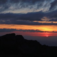 Colorful sunset over Mount Sigriswiler Rothorn. View from Mount Niederhorn, Switzerland.